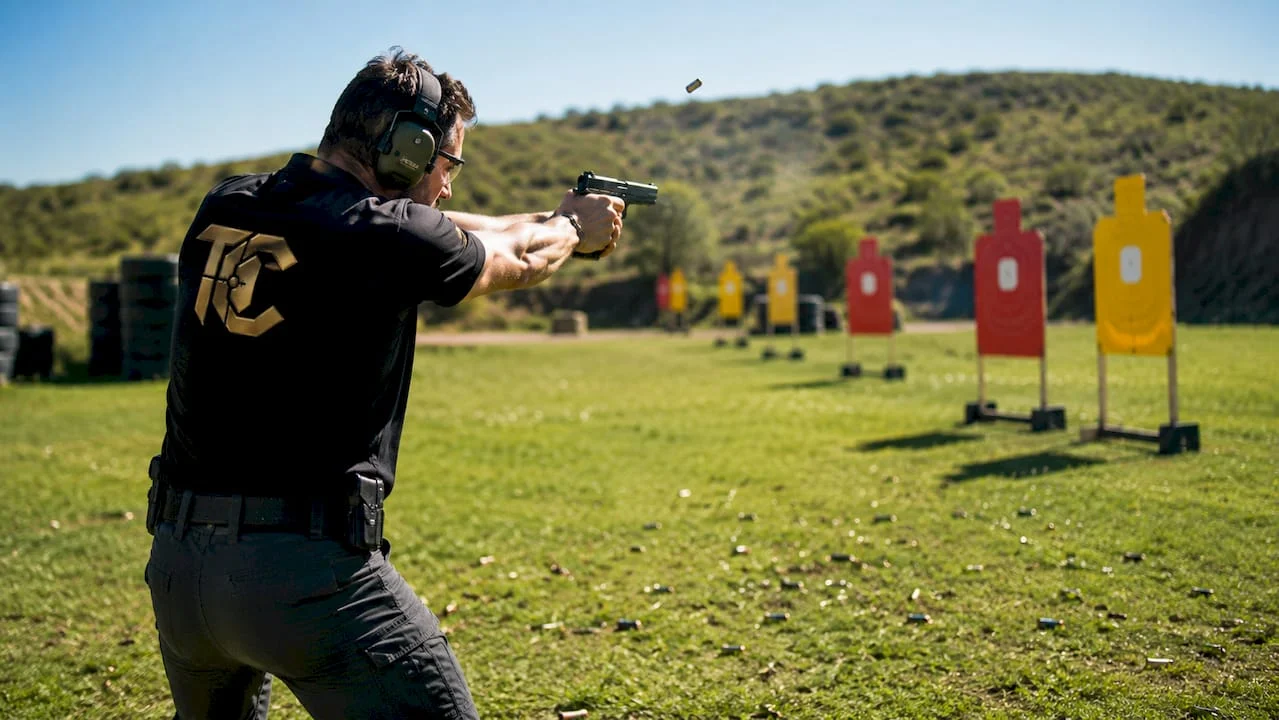 Shooter practicing drill at outdoor range